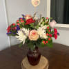 this lovely assortment of fresh flowers which will include roses, carnations, fugi