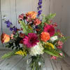 Vibrant, fresh and bold, this arrangement is a burst of joy that