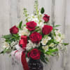 Red roses with white stock and alstro in a red vase perfect