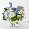 Let this uplifting arrangement be reminders of the clear skies ahead. Capturing