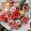 Blush &amp; Scarlet Symphony is a romantic, garden-inspired bouquet bursting with rich