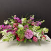 Mixed flowers in plastic container 