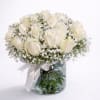 A timeless arrangement of pristine white roses surrounded by delicate baby&rsquo;s breath