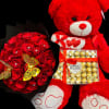 The set includes a medium-sized Teddy Bear, a 50 Red Roses Bouquet