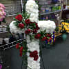 In His Arms Standing Cross Sympathy Spray is the perfect sympathy tribute