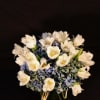 Hydrangea and tulips arranged in a glass vase 