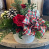 This arrangement will bring festive cheer into any home, transforming a space