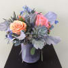 Sunny succulents mixed with colorful bursts of roses and delphinium 