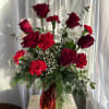 A dozen red flowers!  Six red roses, plus six red carnations