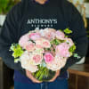 This lush, compact arrangement features a gorgeous collection of pink roses, hydrangeas