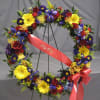 Gerbers, roses, iris, asters and more in red, yellow, purple and blue