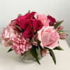 Vibrant and fabulous, Miss Piggy is a compact-style arrangement with pink flowers