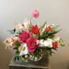 A sweet and lovely arrangement of early springtime blooms, evoking a whimsical