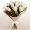 A timeless arrangement of twelve pristine white roses symbolizing purity, peace, and