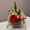 The cutest little cube vase with the prettiest flowers! Roses and mini