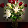 Our &ldquo;Mi Amour&rdquo; floral arrangement featuring an appealing bundle of red roses