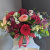 A beautifully selected bunch of the freshest flowers in a vase uniquely