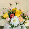 This wintery bright bouquet will bring back the light, sure to warm