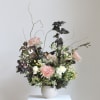 Our "Very Demure" arrangement offers a refreshing alternative to traditional florals. Featuring