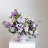 The Amethyst Arrangement features a balanced mix of soft lavender and deep