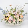 A pretty mix of pastel,  premium blooms which include roses, lisianthus