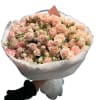 A lush, full bouquet of peachy-blush roses and delicate spray roses &mdash;