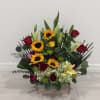 A romantic Valentine&rsquo;s Day arrangement featuring bright sunflowers and passionate red roses