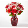 Red vase with roses, carnations, alstroemeria and greens