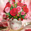 Poetic and romantic, over three dozen luscious garden roses and snapdragons shimmer