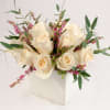 Simple elegant with muted pastel rose. A dozen roses compactly arranged in