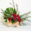 a dozen of roses, combination of red and pastel, arranged in white