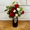 Red Roses, white snapdragons, red alstroemeria, and white mini carnations arranged in