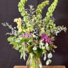 This fresh, garden-style arrangement is full of movement and natural elegance. Featuring