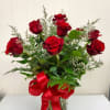 A modern twist on a classic! A dozen roses with limonium and