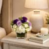  Lavender Charm is a breathtaking floral arrangement that blends soft romance