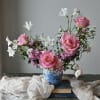 Textural and playful in design in a blue and white floral pot