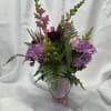 Pink snapdragon, lavender daisy, pink tulips, purple carnations, &amp; solidego in a
