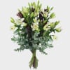 A stunning bouquet of pure white lilies combined with lush greenery for