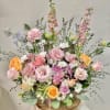 
Product Information
Theme Colors: Shades of light pinks, purples and peachy.

Featured Blooms: Roses