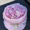 Bouquet of pink roses in pink packaging 
