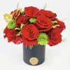 Elegant arrangement of 10-12 roses in a beautiful Round box