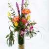 A bright and fun tropical arrangement using roses and protea.