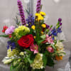 Mixed arrangement of hydrangea roses, liatris ,Daisy's, Alstroemeria carnations, and delphinium it's