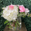 Delicate, graceful, and full of charm &mdash; this floral arrangement is a