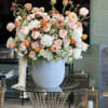 A soft mix of pastel shades, including Garden Roses, Peonies, Anemones, and