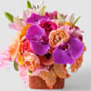 Send this beauty today with it's violet and blush colored blossoms of