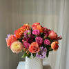 Brighten up the mood with this beautiful arrangement. Medium sized with a