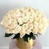 Beautiful golden vase filled with white roses