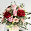A floral arrangement of premium red and pink roses mixed with pink