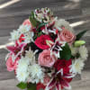 This amazing bouquet is of lilies ,mini carnation,greens ,and a mix of